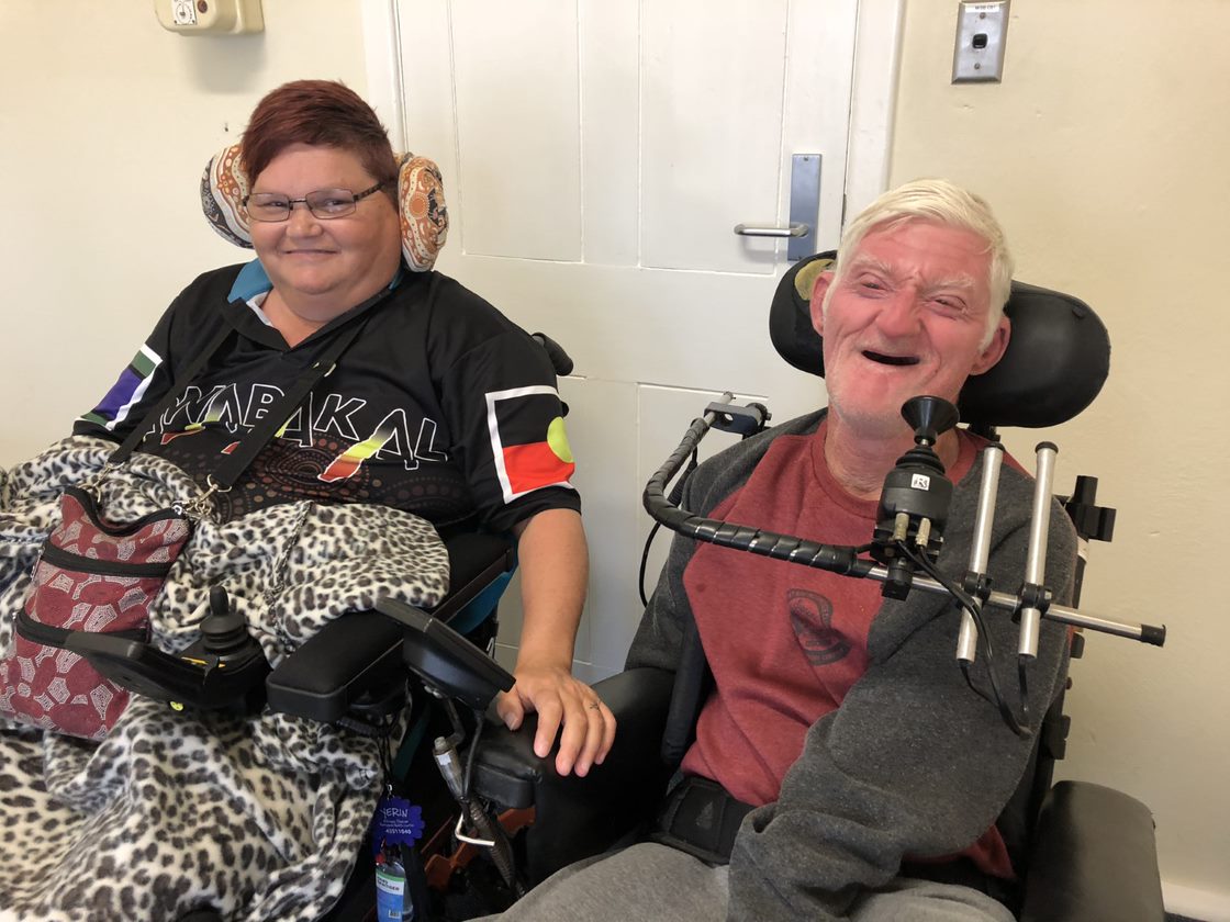 Two people with disabilities